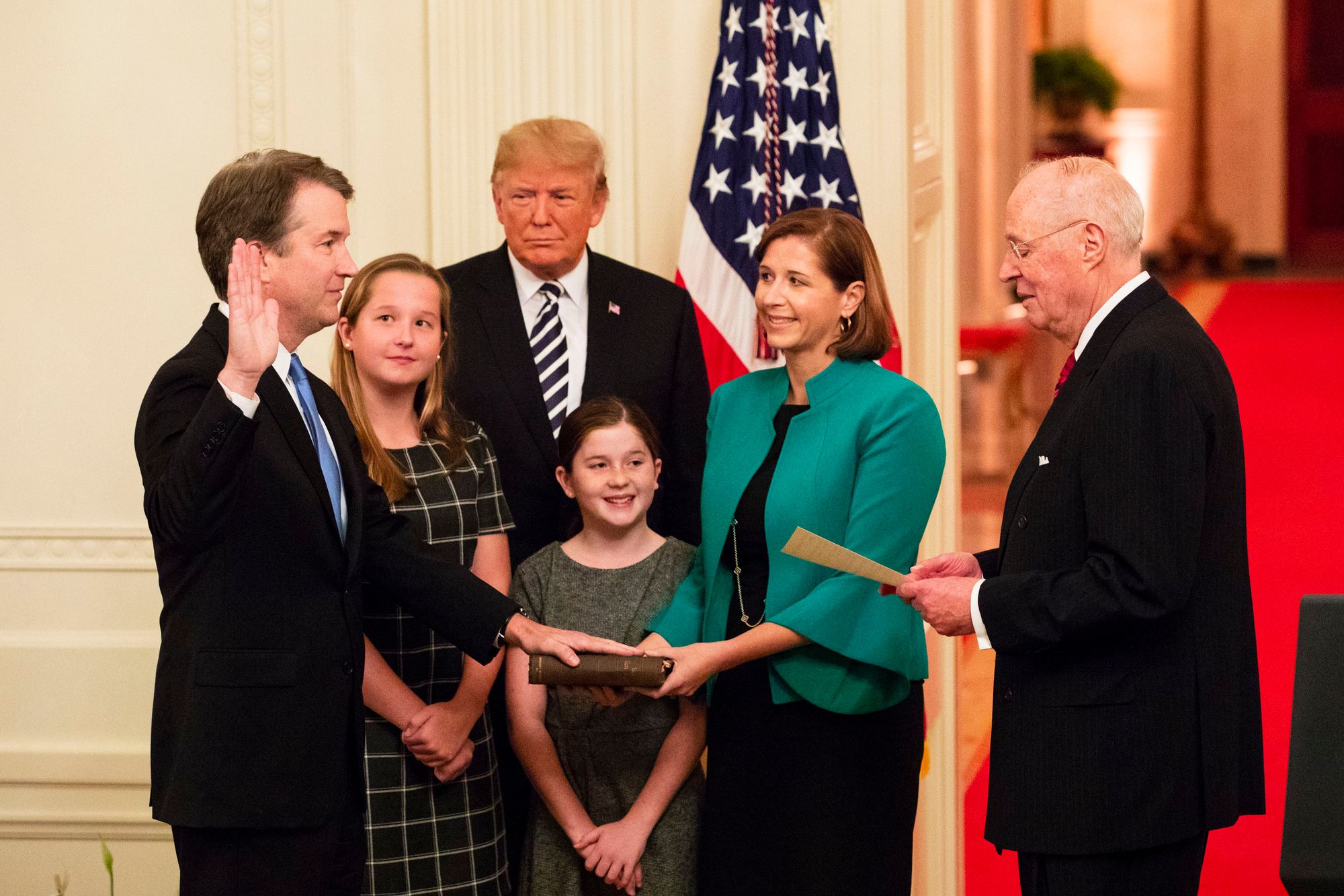Justice Kavanaugh, who has been under threat, being sworn in with his family at the White House. Image: White House 