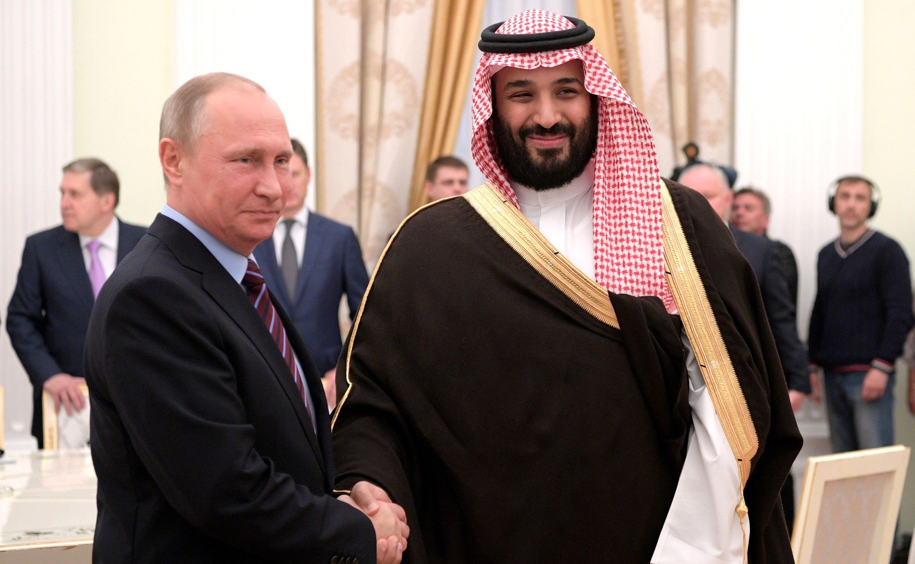 The Saudi crown prince (right) shakes hands with Vladimir Putin. Image: The Kremlin