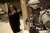An Iraqi woman yells at a U.S. soldier in 2007 during the search of an Iraq's home. Photo by Sgt. Tierney Nowland