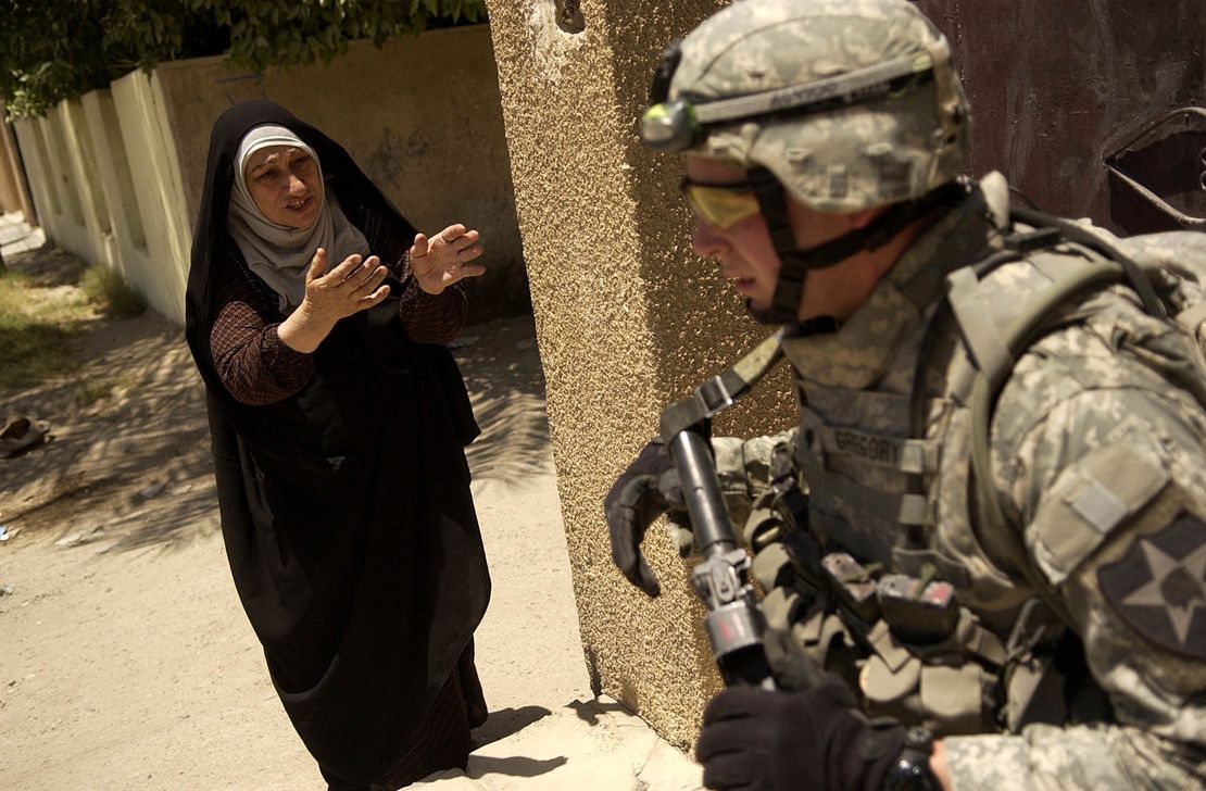 An Iraqi woman yells at a U.S. soldier in 2007 during the search of an Iraq's home. Photo by Sgt. Tierney Nowland