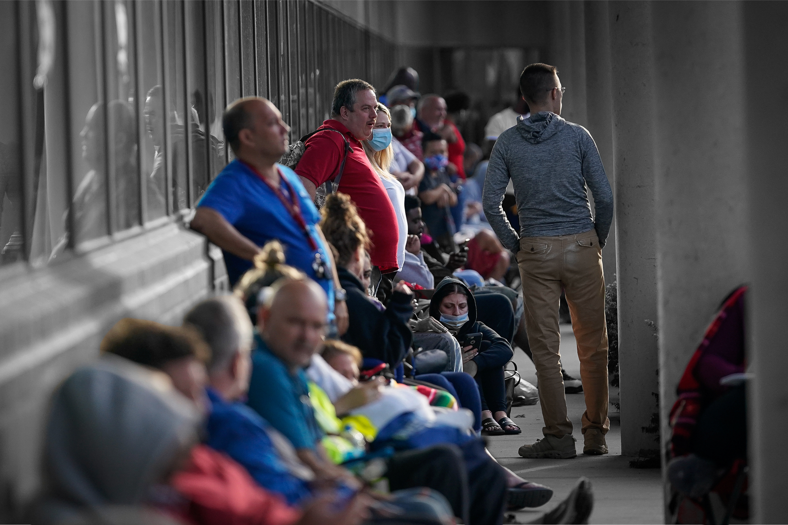 People line up outside a Kentucky Career Center prior to its opening to find assistance with their unemployment claims in Frankfort, Kentucky