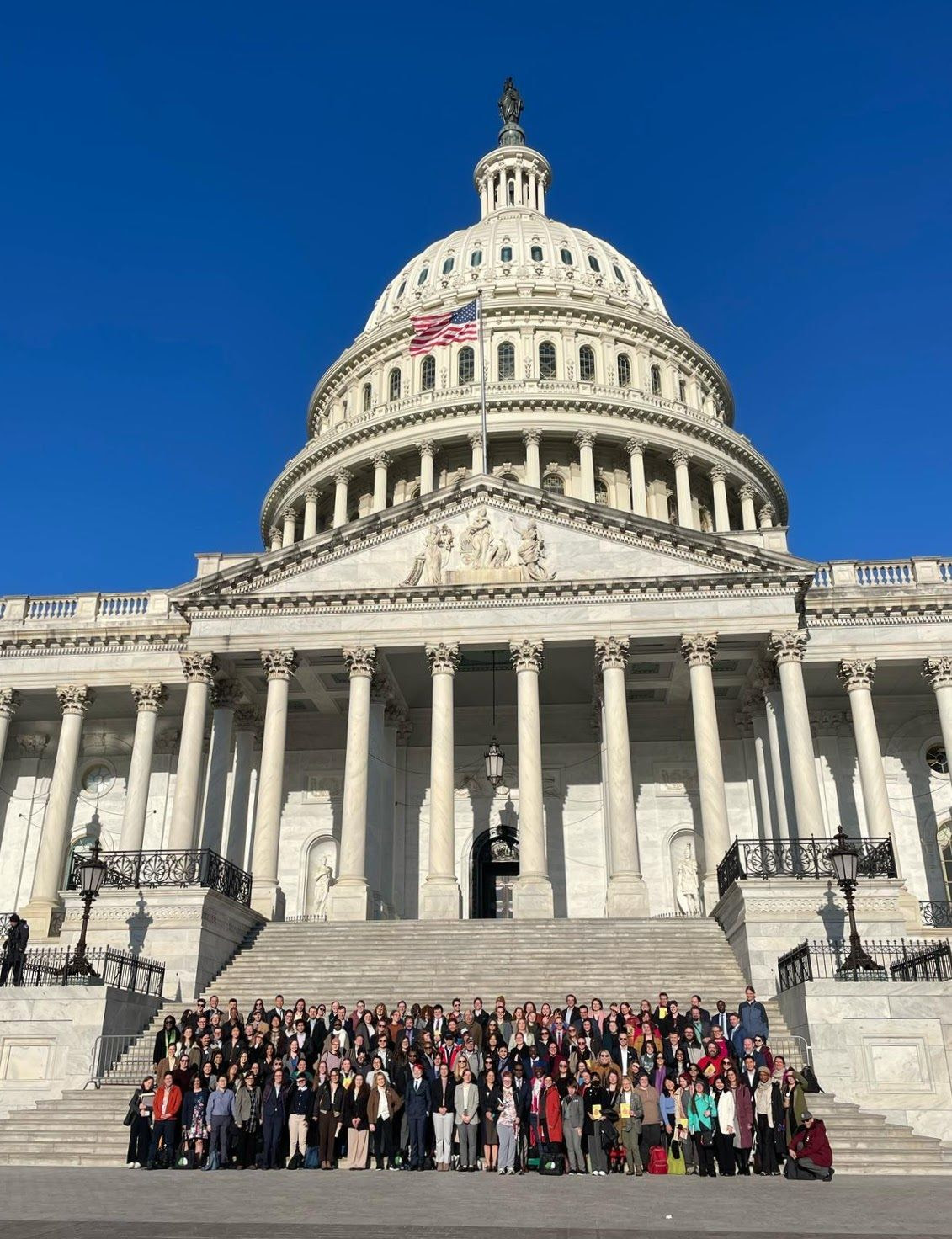 The author with some new friends in front of the U.S. Capitol in Washington, D.C. | Image: Kristen Buse