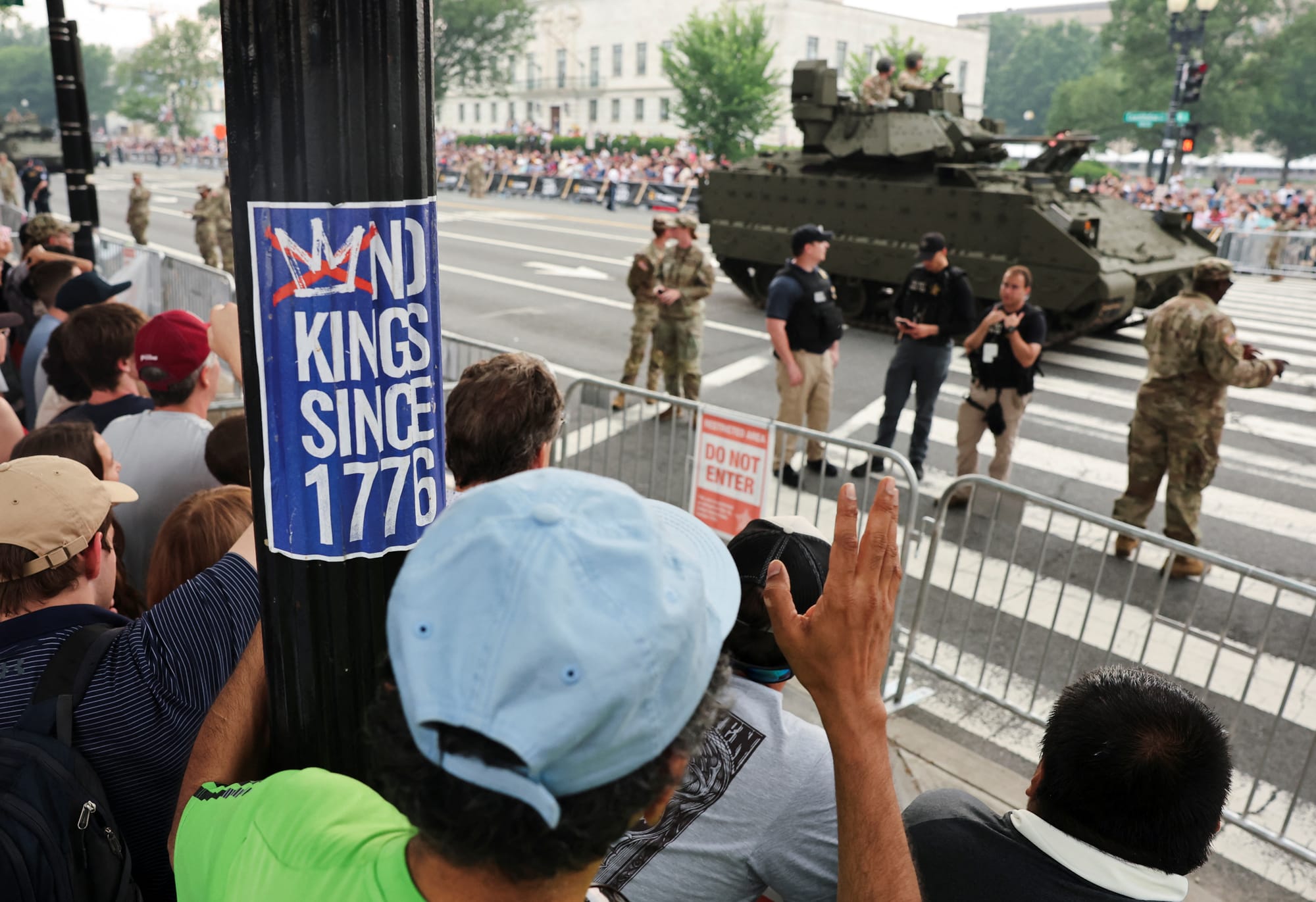 A No Kings sticker and a Bradley Fighting Vehicle at the military parade in Washington, D.C. | REUTERS/Jonathan Ernst
