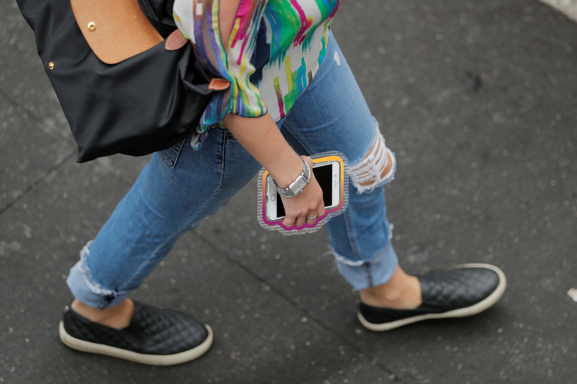 A woman with an iPhone. REUTERS/Lucas Jackson edited by Russell Nystrom