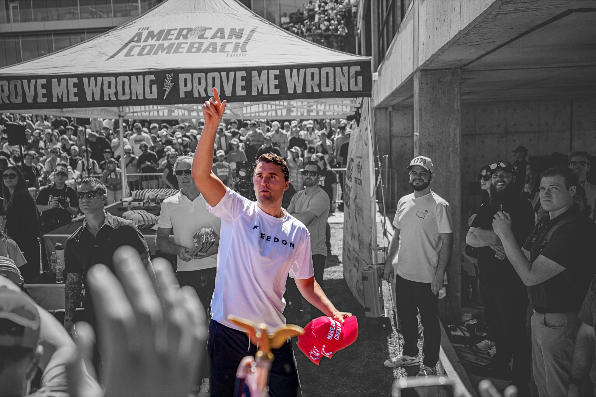 Charlie Kirk throwing hats to the crowd at Utah Valley University in Orem, Utah | Trent Nelson/The Salt Lake Tribune via REUTERS, edited by Russell Nystrom