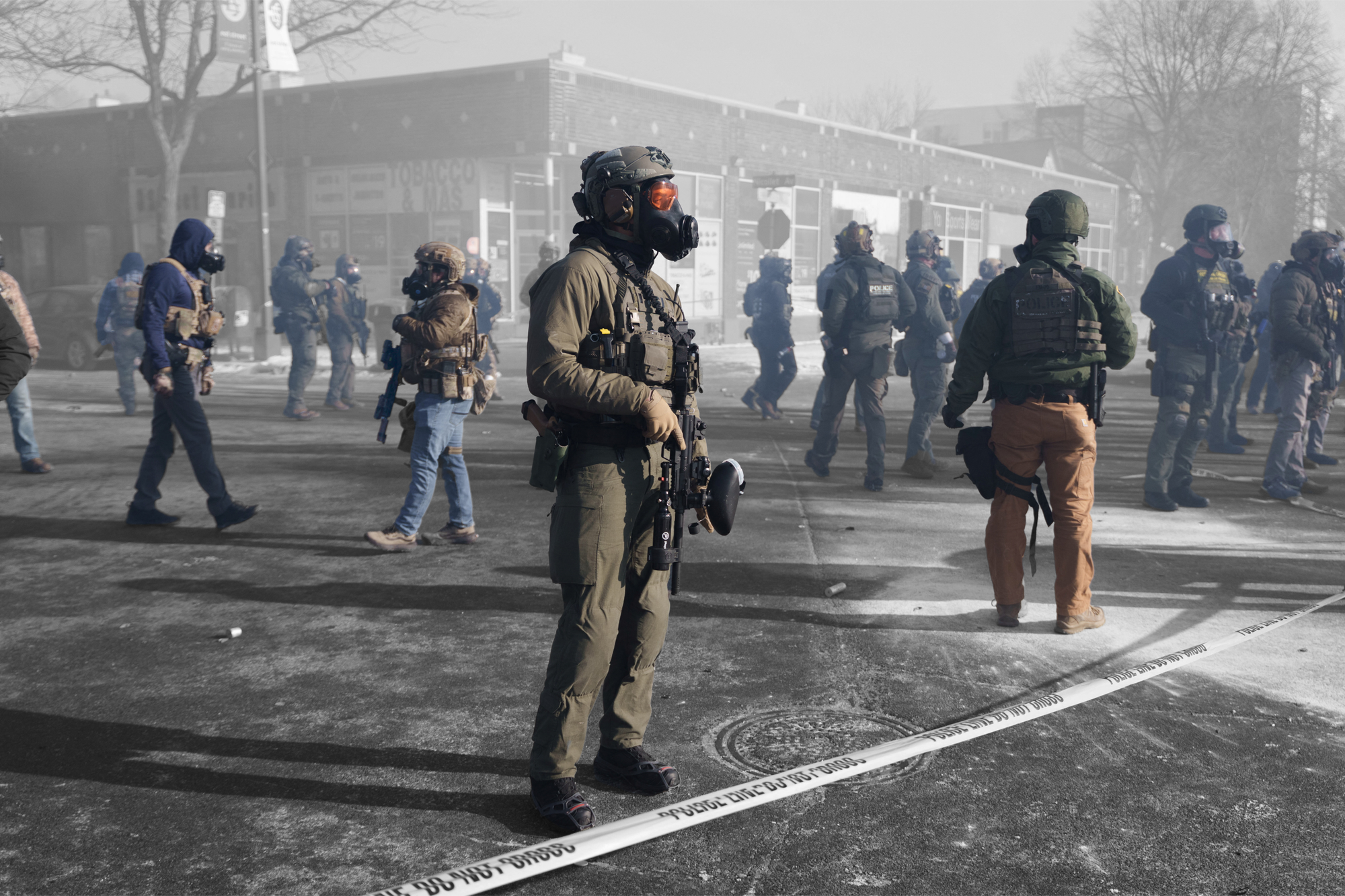 Federal agents stand amid teargas in Minneapolis, Minnesota — January 24, 2026 | REUTERS/Tim Evans, edited by Russell Nystrom