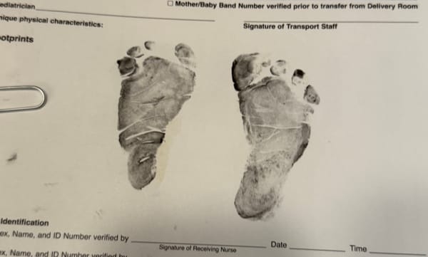 Baby footprints on a medical document.