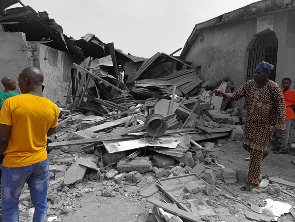 Residents inspect the damage after U.S. forces had launched a strike against Islamic State splinter groups in Nigeria | REUTERS/Abdullahi Dare Akogun, edited by Russell Nystrom