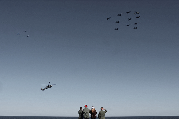 President Donald Trump and First Lady Melania Trump aboard the aircraft carrier USS George H.W. Bush on October 5, 2025 | REUTERS/Jonathan Ernst, edited by Russell Nystrom